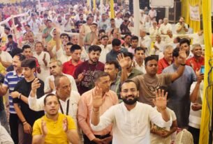 By pulling the chariot of Lord Krishna