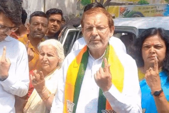 Dr. in Jhajjar. Arvind Sharma cast his vote