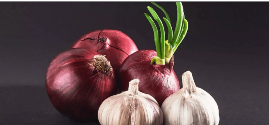 Why are garlic and onions used in worship?